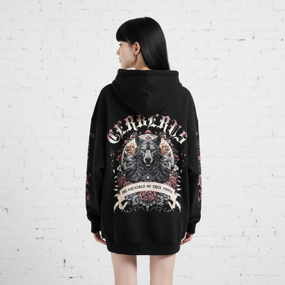Back view of female model with black hair and bangs wearing black oversized hoodie