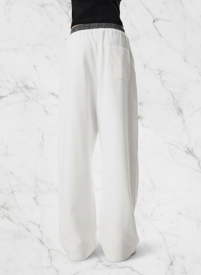 Back view with white stone background