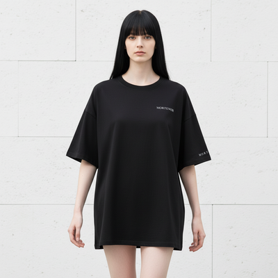 Female model in candid walking pose wearing black t-shirt