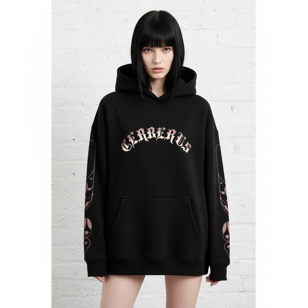 Front view of female model with black hair and bangs wearing black oversized hoodie