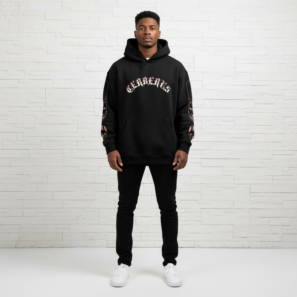 Front view of male model wearing black oversized hoodie