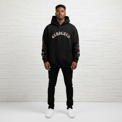 Front view of male model wearing black oversized hoodie