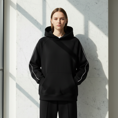 Front view of Shadow Black Contrast Piping Raglan Hoodie with natural lighting