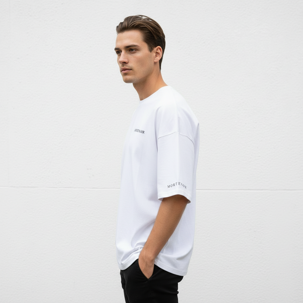 Model wearing white MORTENOIR t-shirt right side with sleeve text